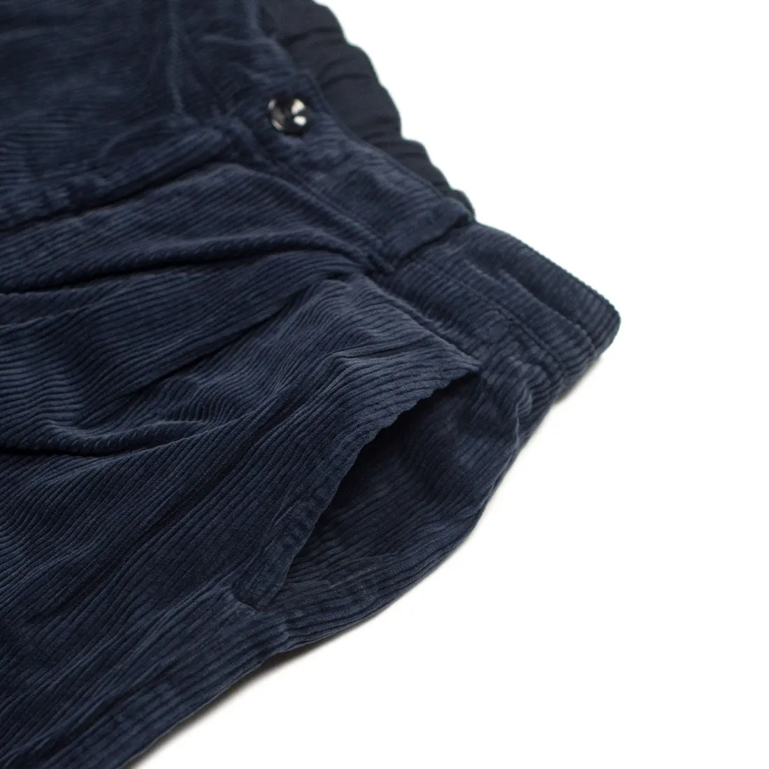 One tuck trousers in indigo-dyed cotton corduroy