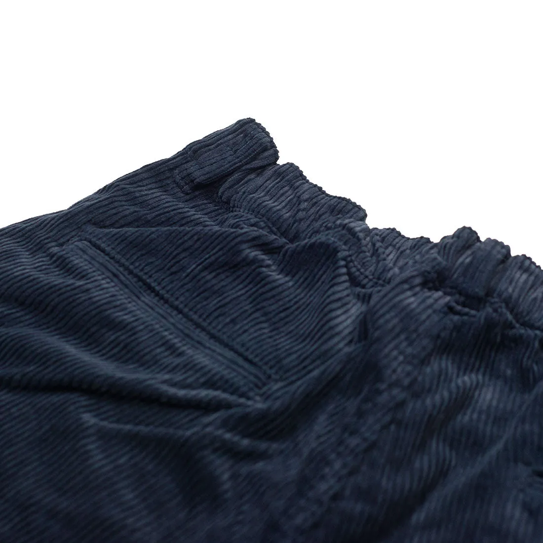 One tuck trousers in indigo-dyed cotton corduroy